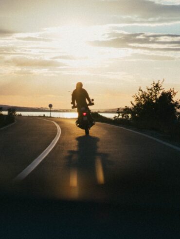 https://www.pexels.com/photo/person-riding-motorcycle-during-golden-hour-1416169/