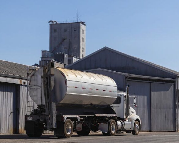 Photo by Robert So: https://www.pexels.com/photo/tanker-for-transporting-grain-feed-in-front-of-warehouses-18468412/